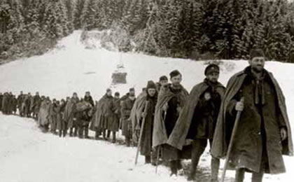 Slovak Republic, the terrain near to Lom Krpacovo in Low Tatras Mountains, November 15, 1944; A part of the 2nd Czechoslovak Paradesant  Brigade, military unit,  walked in a long file, more than a hundred men, unshaven and bundled-up in long military coats. First walking man is commander Colonel Vladimir Prikryl, second man is Chief of Brigade Staff, Staff Captain Karel Hlasny.